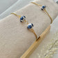Two floral bracelets in blue and white china pottery style on a bracelet holder
