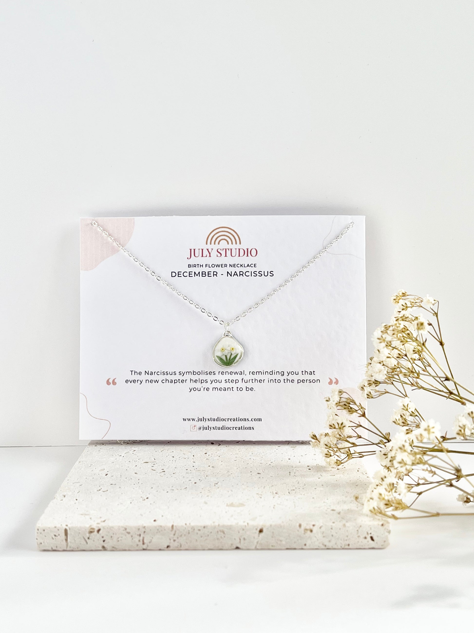 Silver clay necklace on a jewellery card with 'July Studio' branding, featuring dried flowers on a light background.